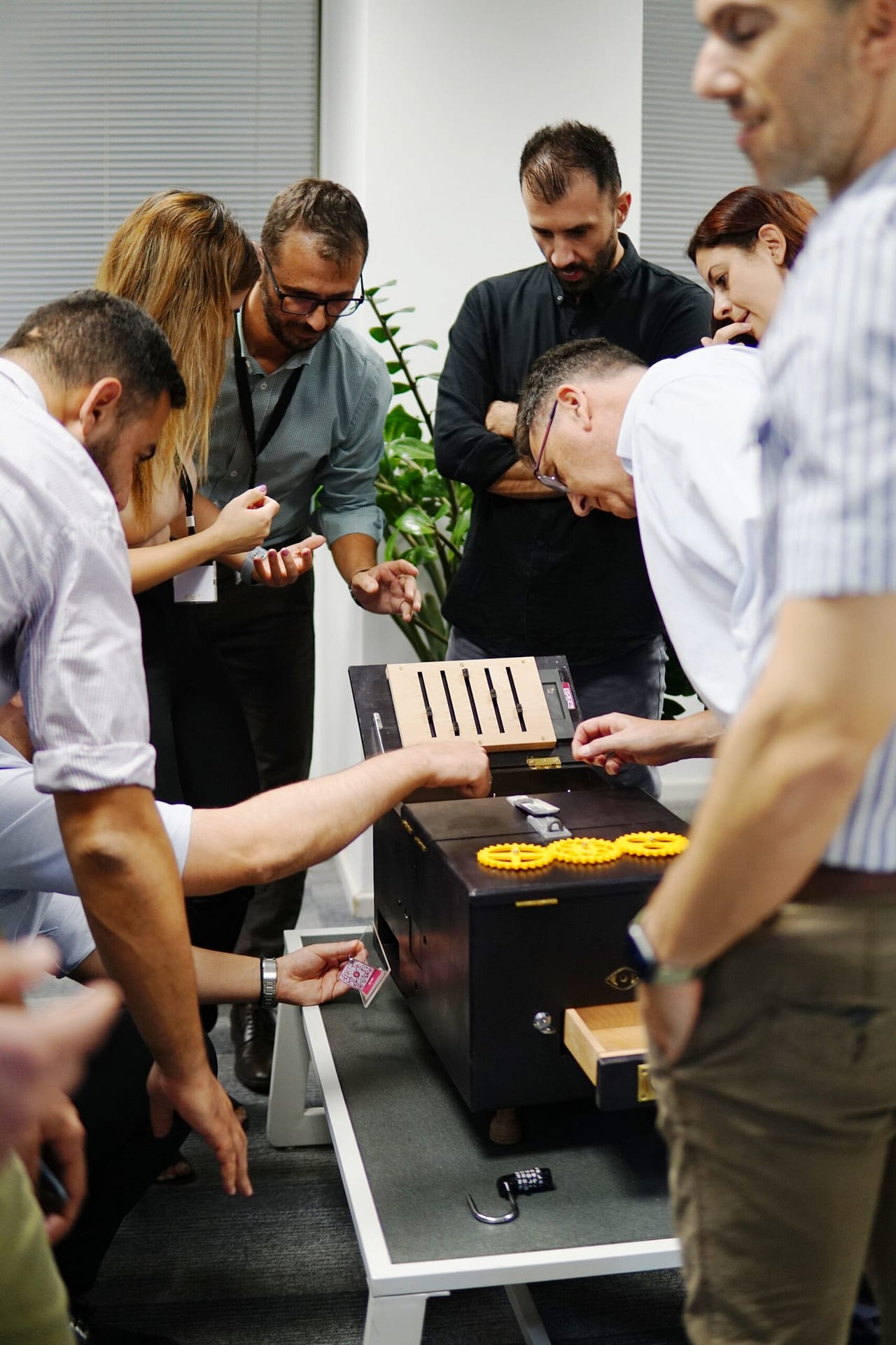 Colleagues collaborating on puzzles during the game